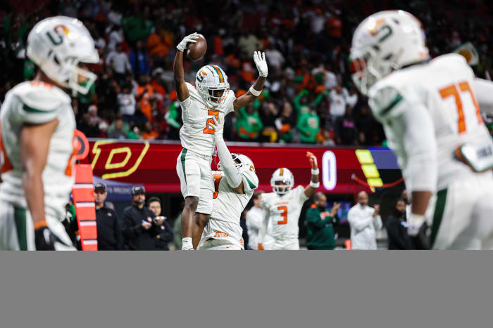Stockbridge's Jayden Howard gets a "lift" after scoring a touchdown against Perry in the Georgia 4A state championship game. 12/12/2023